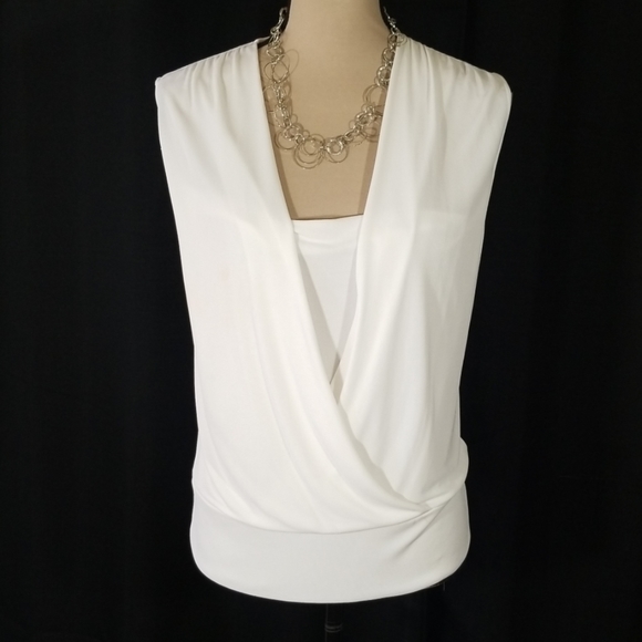 Tops - White sleeveless top. Size L